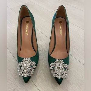 Green high heel shoes (never worn).